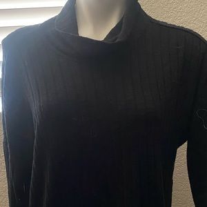 Black casual loose fitting sweater.